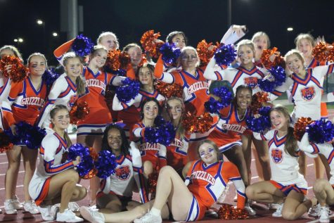The cheerleaders celebrate the victory against Liberty in solidarity.