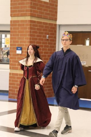 As the king, Severin Bohn (24) and queen, Makiya Bolden (25) of the last banquet enter, the audience yells Huzzah! I had to come to America to become King, German exchange student Bohn said.