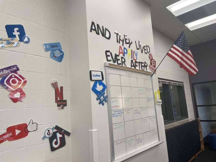 The library has mobile app themed decorations on the wall.