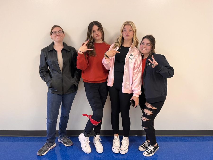 Tabitha Gavers (23), Avery Kuehl (25), Kylie Mueller (24) and Olivia Pender (24) share their spirit by dressing in Grease inspired outfits.  Gavers wishes we would have a PJ day.  STUCO loved how many people participated this year. A lot more participated and that got them excited for HOCO, Kuehl said. It made Student Council really happy.  Some students even went out and bought outfits for the spirit days. I ordered my Pink Lady jacket just for this spirit day, Mueller said.