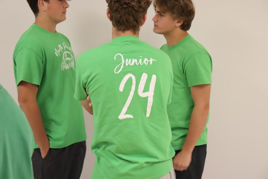 The juniors dressed in green to show their school spirit. Lukas Carroll (24), Christian Mattern (24) and Luke Gertken (24) share their thoughts about this years spirit week. Its nice to see the hallways filled with vibrant colors and its interesting to see what people are going to wear, Gertken said.