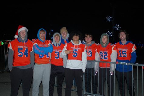 The football team stayed warm in their football gear and had several jobs throughout the park.
