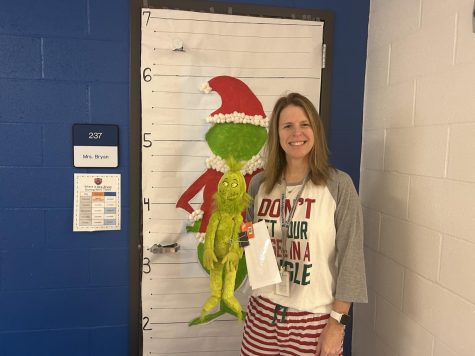 English teacher, Mrs. Bryan, has been working on her holiday Grinch door with her DEN time and she was grinched by Mr. Clamors.
