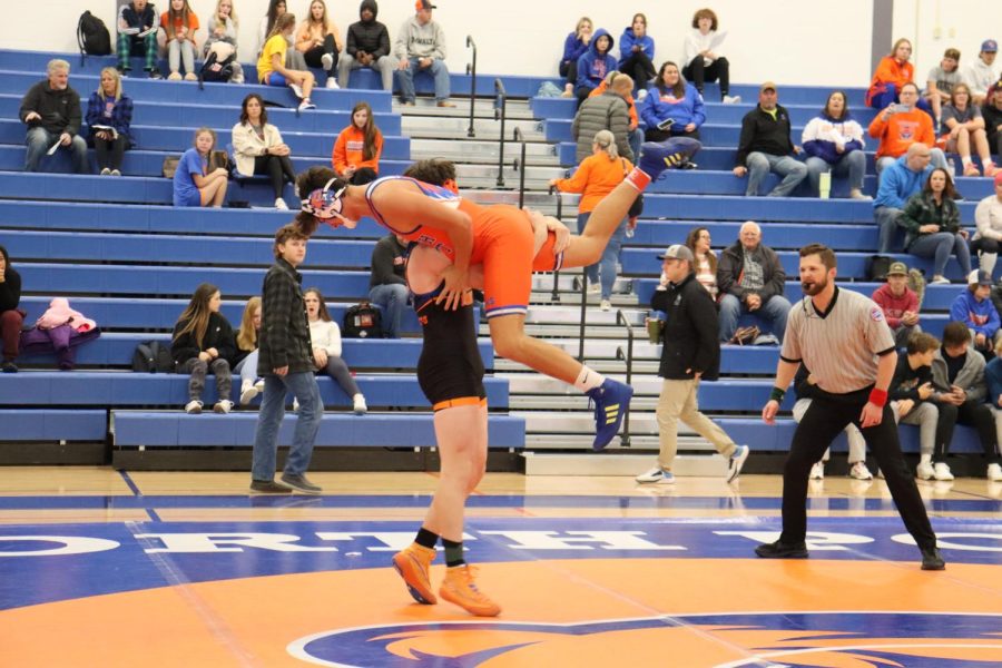 Domenic Colombotto (25) lifts Brody Williams (24) for the take down.