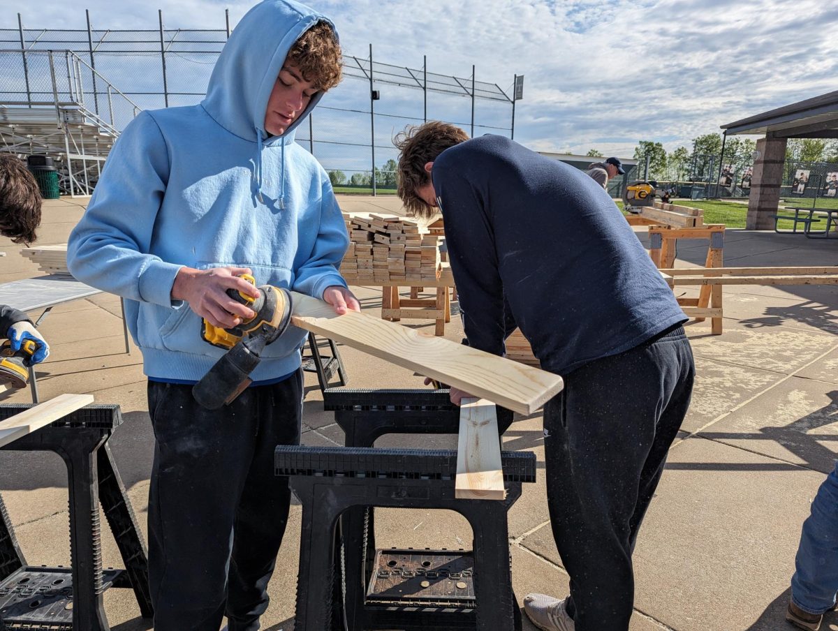 Brayden Eckelkamp (‘25) and Brayden Bass (‘27) continue sanding off the slates for the bed.