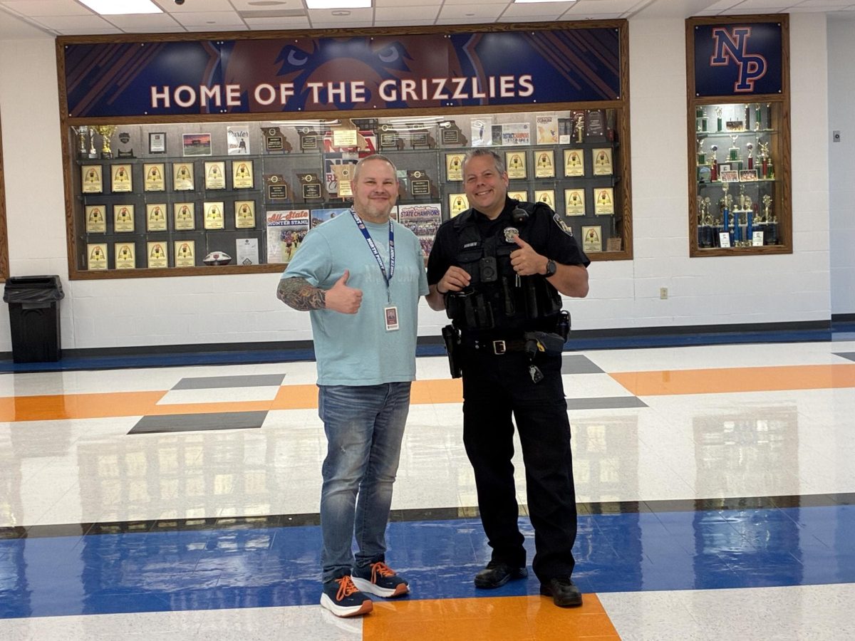 Our counselor, Mr. Laughman, stands next to Officer Horvath, his past profession.