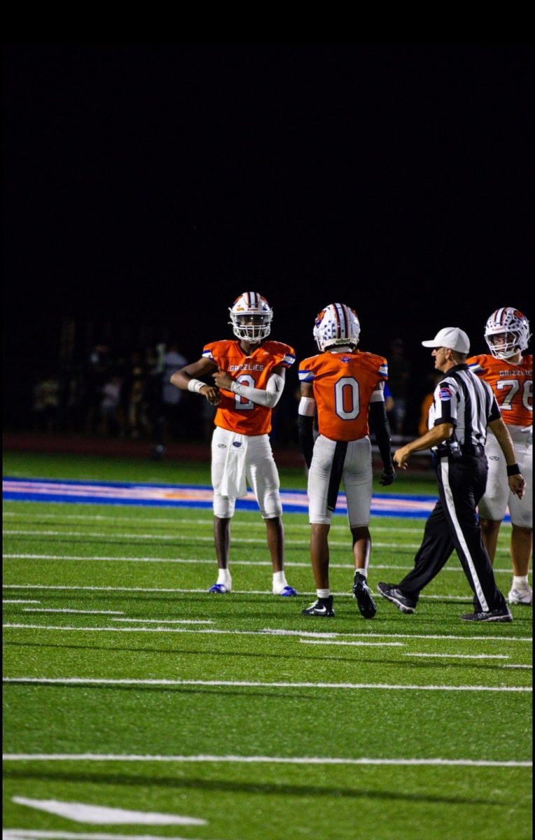 The Williams Brothers share a moment on the field.