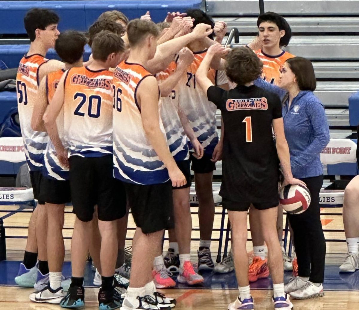 Coach Pezzelle coaches both the girls and boys volleyball team.