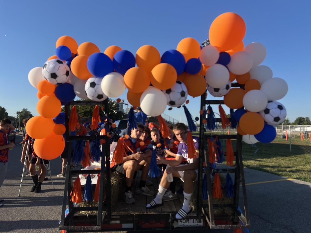 The JV soccer team is ready to throw candy and start the weekend off right.