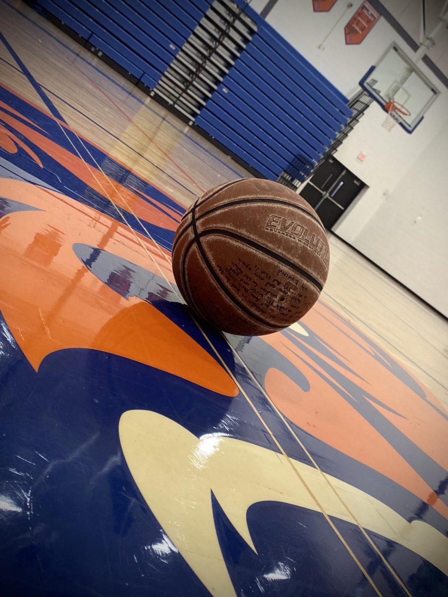 a basketball sits in the middle of the court 
