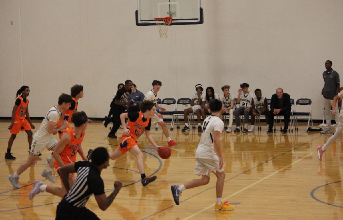 Our boys hustling on the Court to get the ball in the basket. 