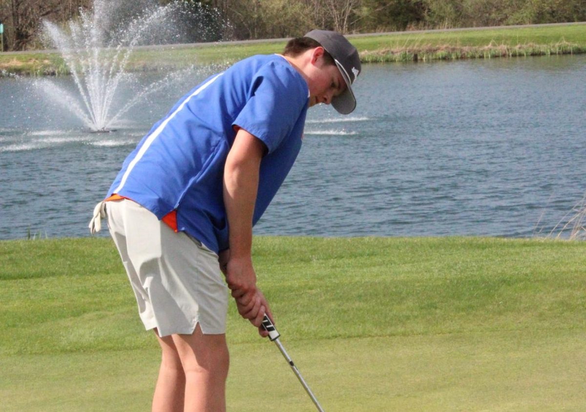 Owen Willman (28) gets ready to putt.
