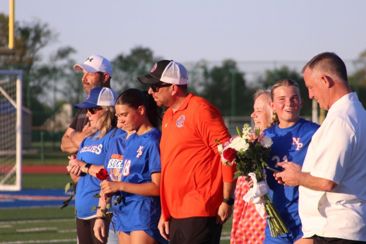 The girls soccer team celebrates senior night.