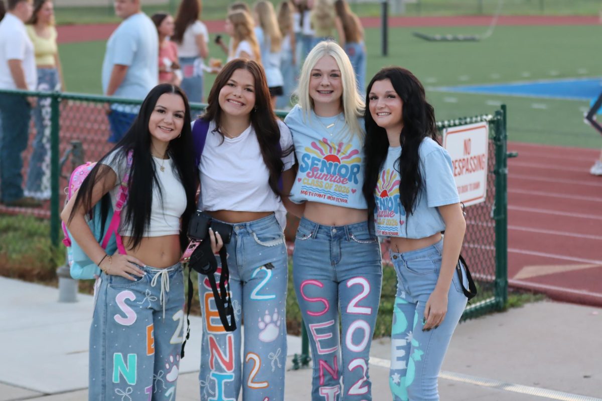 Seniors gathered together having fun watching the sunrise.