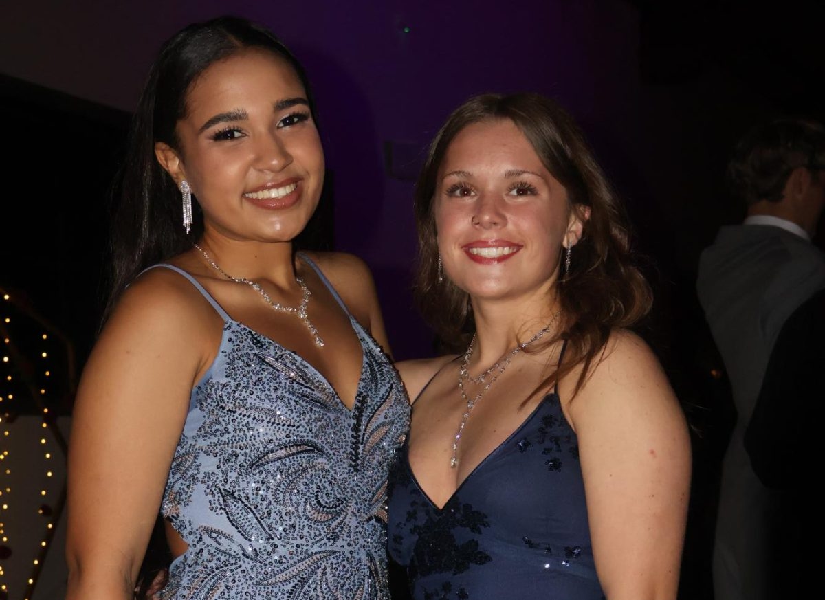 Having fun taking pictures and dancing the night away at prom.